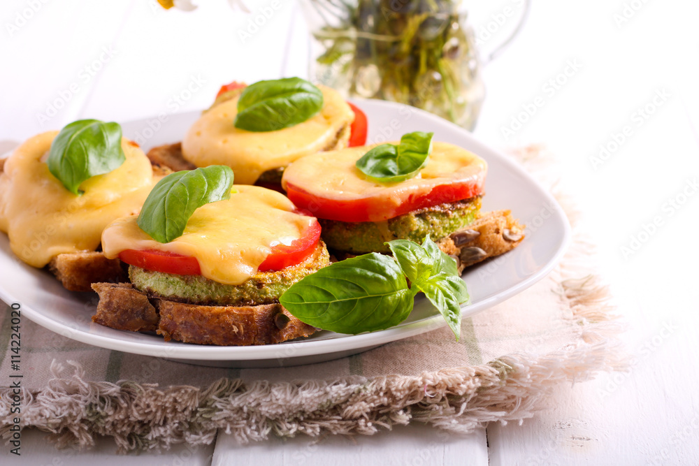 Zucchini, tomato and cheese appetizer