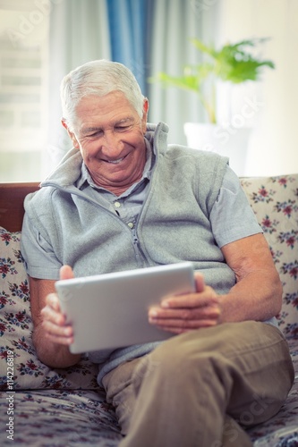 Senior man using digital tablet © WavebreakMediaMicro