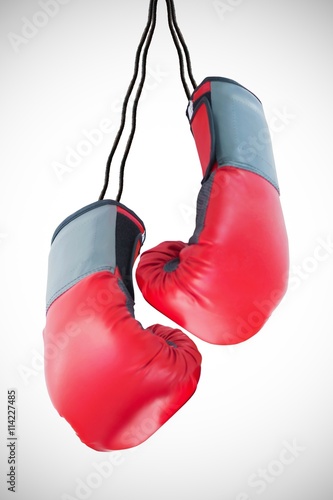 Boxing gloves attached to white background © vectorfusionart