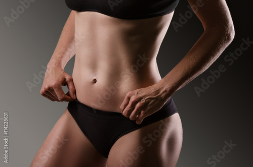 Female sexy body in black underwear.  Woman body care.