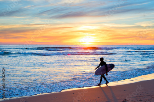 Surfing at sunset