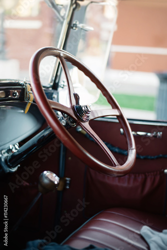the driver's seat of an old car