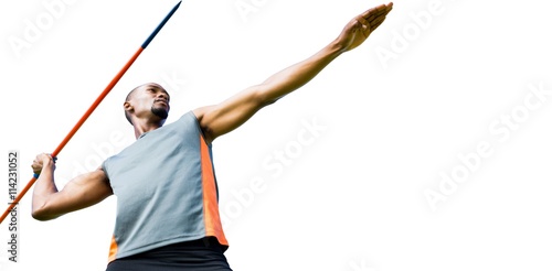 Low angle view of sportsman practising javelin throw 