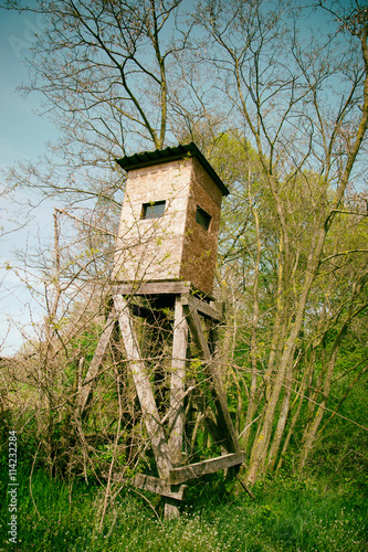 Wooden lookout tower for hunting in the woods © lukasbeno