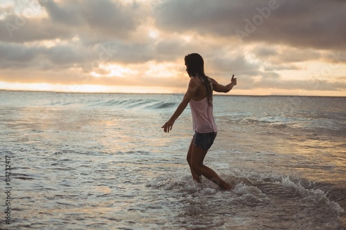 Beautiful woman having fun on the beach