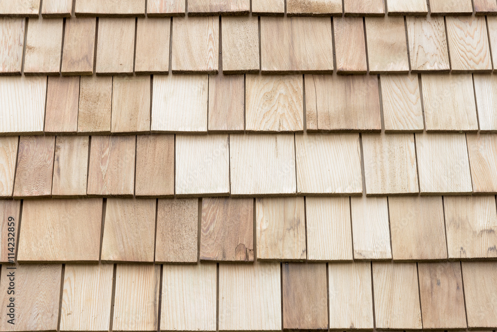 Several wood cedar shingles for siding or roofs. Several wood cedar shingles for siding or roofs.