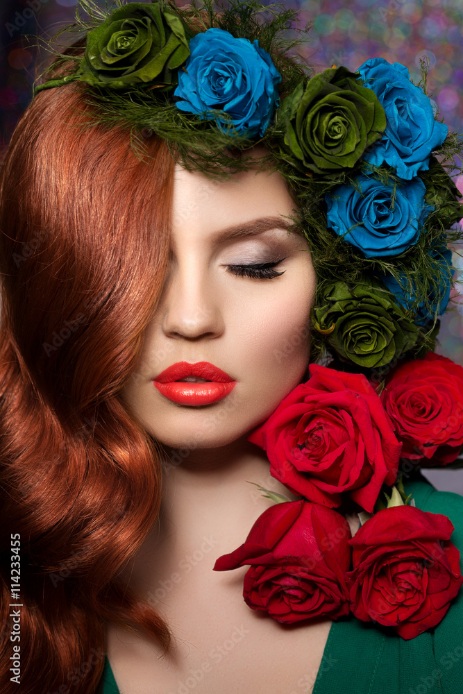 Beautiful model woman with blue, green and redrose flower in hai Beautiful model woman with blue, green and redrose flower in hai