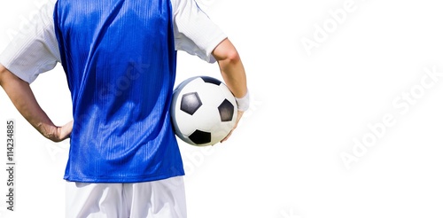 Rear view of football player holding a football 