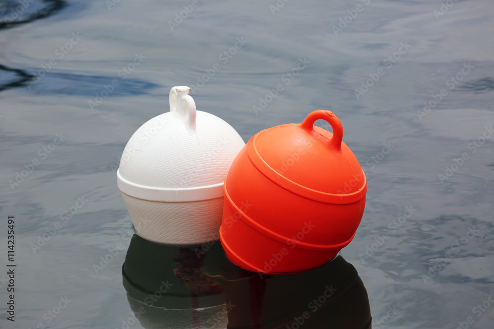 Fototapeta premium Orange And White Buoys