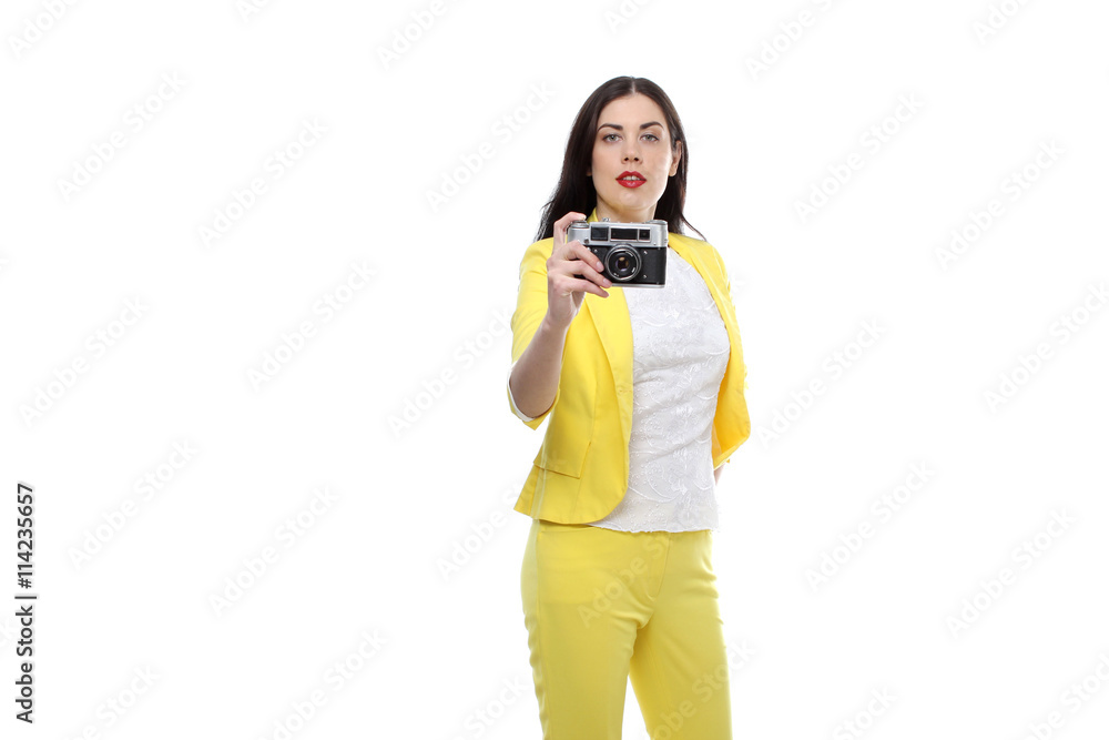 the portrait of beautiful brunette young adult woman wearing on yellow suit and white T-shirt and makes a photo with camera isolated on white background the portrait of beautiful brunette young adult woman wearing on yellow suit and white T-shirt and makes a photo with camera isolated on white background
