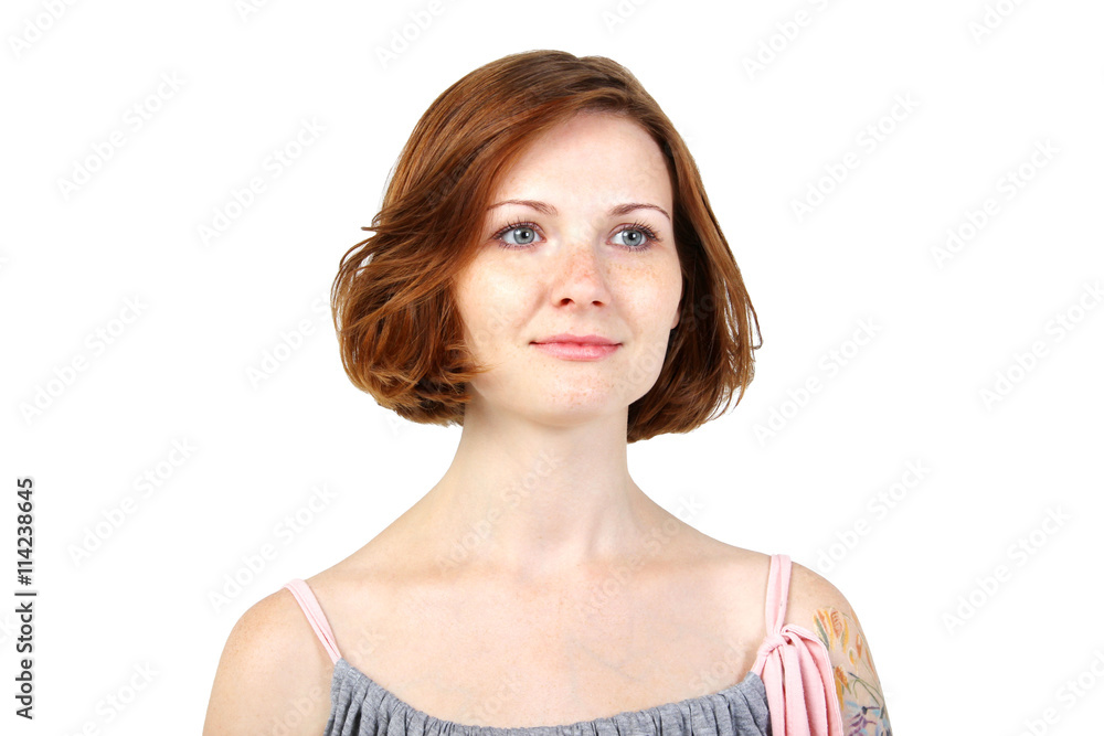 Fototapeta premium the portrait of young adult beautiful girl with freckles and red hair on white background