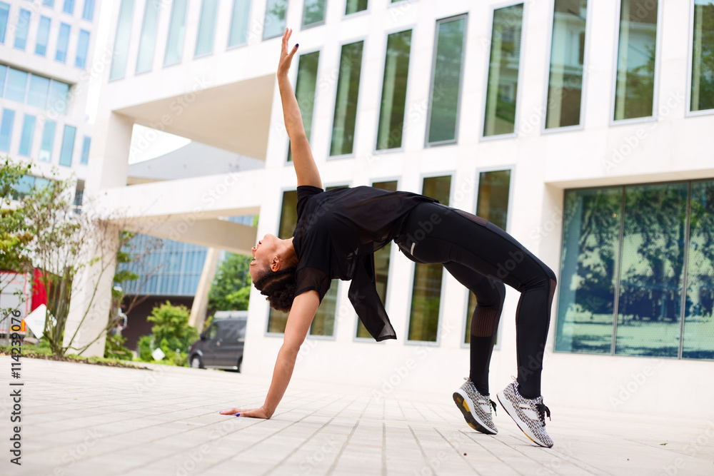 dancer in the street bent backwards pose