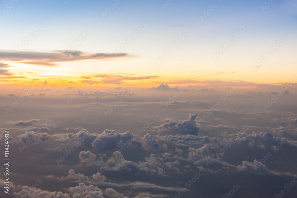 Flying above the clouds at twilight time. Flying above the clouds at twilight time.