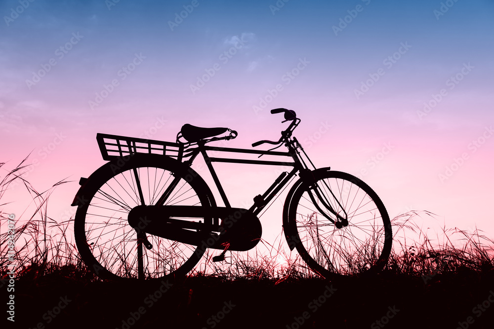 beautiful landscape image with Silhouette Bicycle at sunset in beautiful landscape image with Silhouette Bicycle at sunset in
