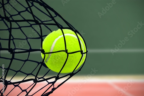 Composite image of tennis ball with a syringe © vectorfusionart