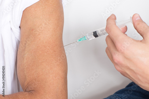 Fotografie Vaccinating a patient