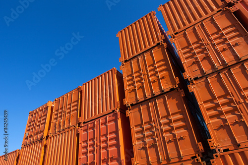 Stacks of orange shipping containers