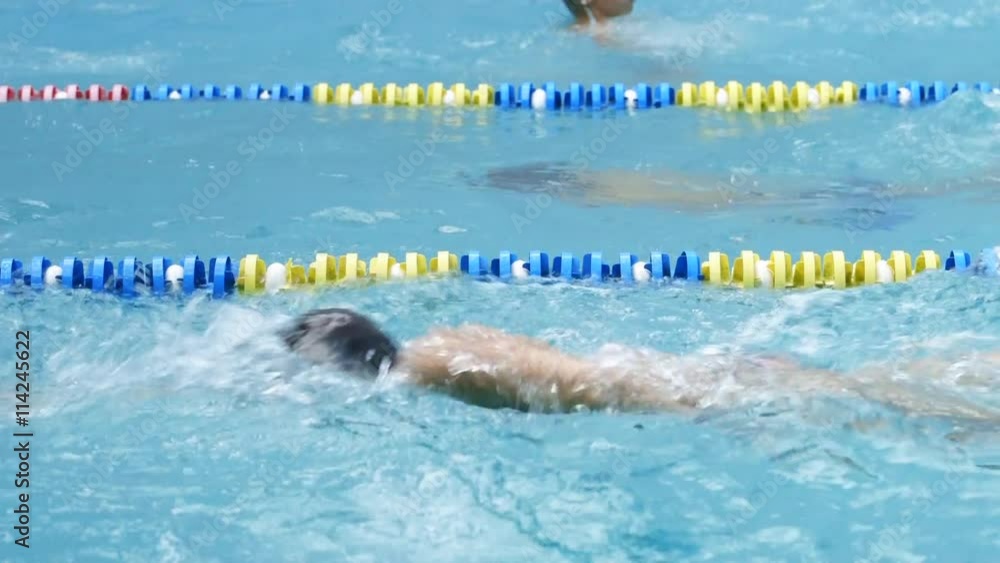 The group of young swimmers in the pool. The group of young swimmers in the pool.