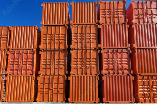 Stacks of orange shipping containers