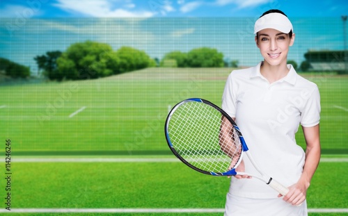 Composite image of female athlete posing with tennis racket © vectorfusionart