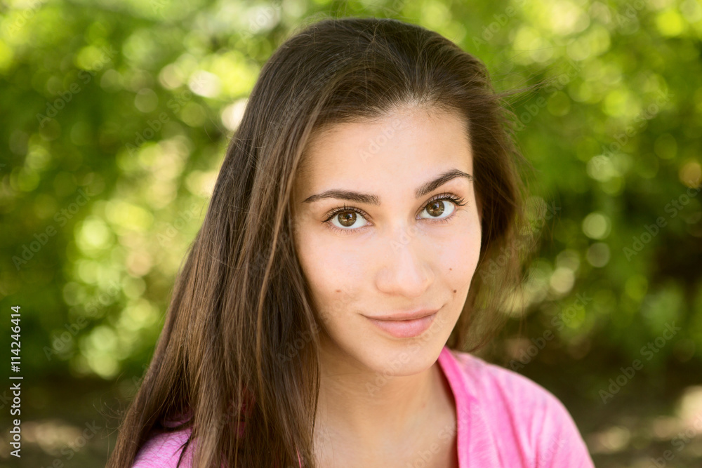 portrait of the young woman outdoors in summer day

