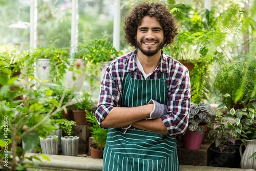 Obraz na płótnie Male gardener with arms crossed at greenhouse