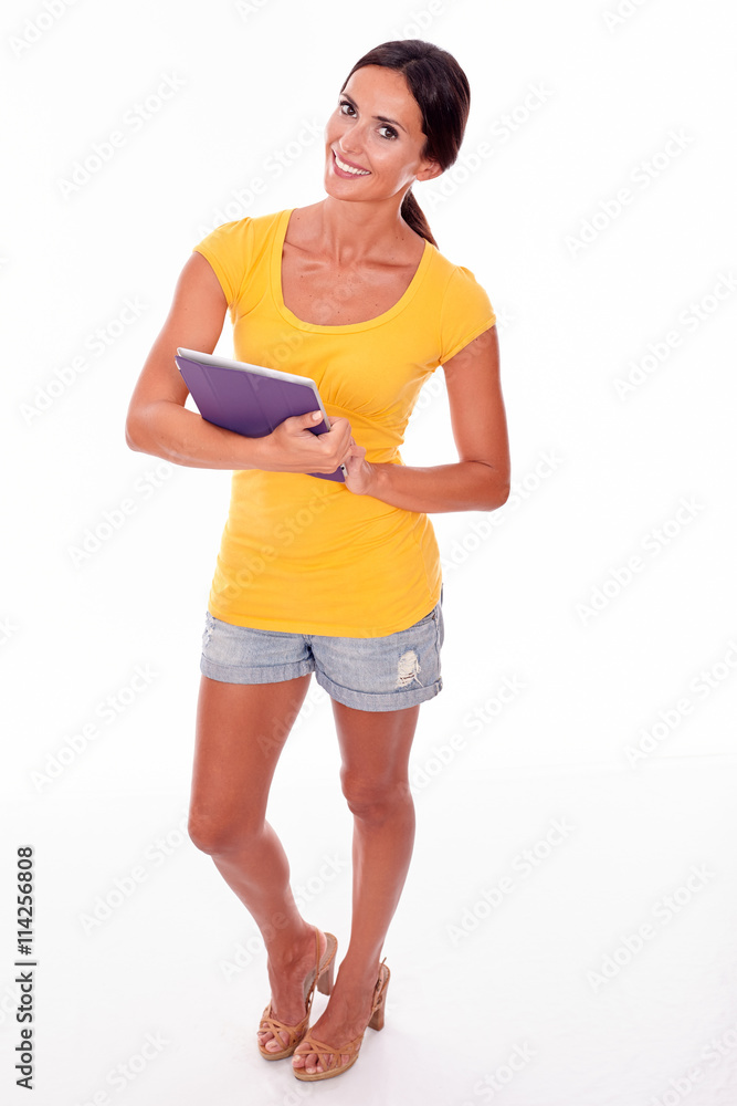 Smiling young brunette with a tablet pc Smiling young brunette with a tablet pc