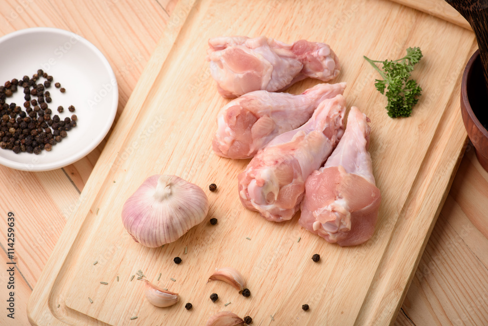 Chicken wings (wingstick) uncooked with garlic black pepper and Chicken wings (wingstick) uncooked with garlic black pepper and