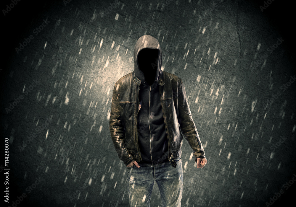 Unknown suspect standing in the dark Unknown suspect standing in the dark