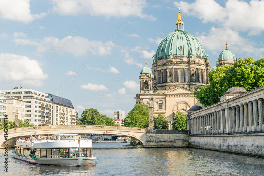 Berlin Cathedral at famous Museum Island with excursion boat river