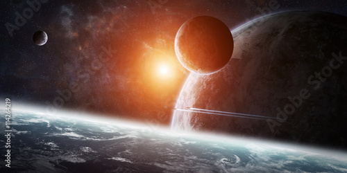 Fototapeta Naklejka Na Ścianę i Meble -  Sunrise over group of planets in space