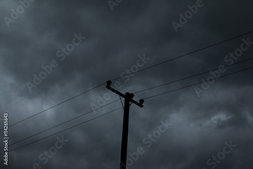 electric pole and Dark sky before rain