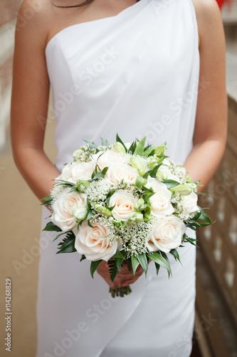 Cream and green bridal bouquet of roses and alstroemeria flowers photo