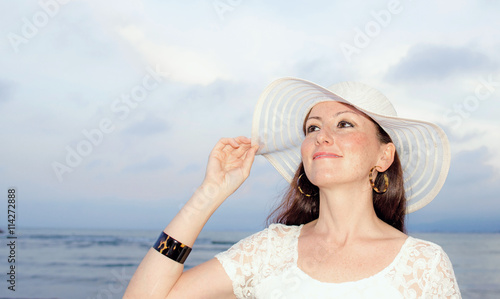 Pretty woman with white hat...