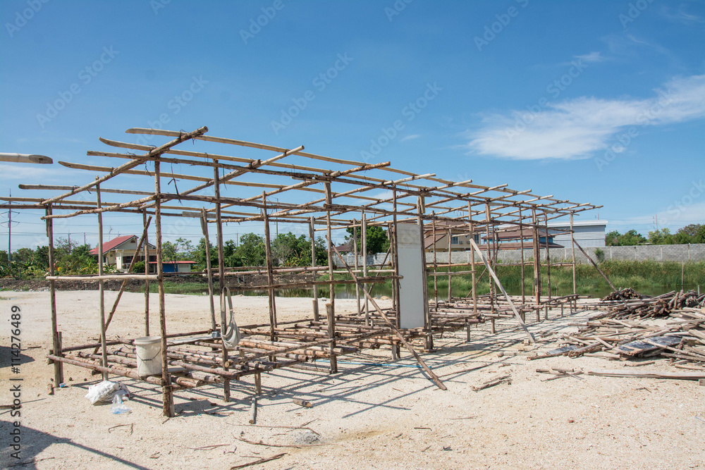wood construction of labor temporary houses in construction site. wood construction of labor temporary houses in construction site.