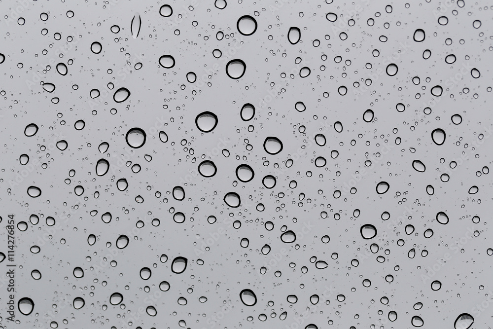 Drop of water for the background on glass car window to abstract Drop of water for the background on glass car window to abstract