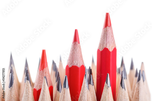 three sharpened red pencil among many ones