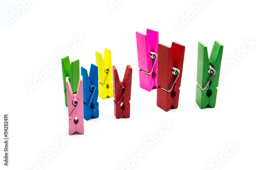 Colorful wooden clothespins isolated on white background