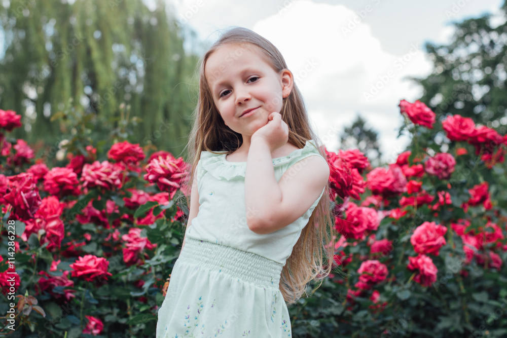 Portrait of a beautiful little girl in the garden Portrait of a beautiful little girl in the garden