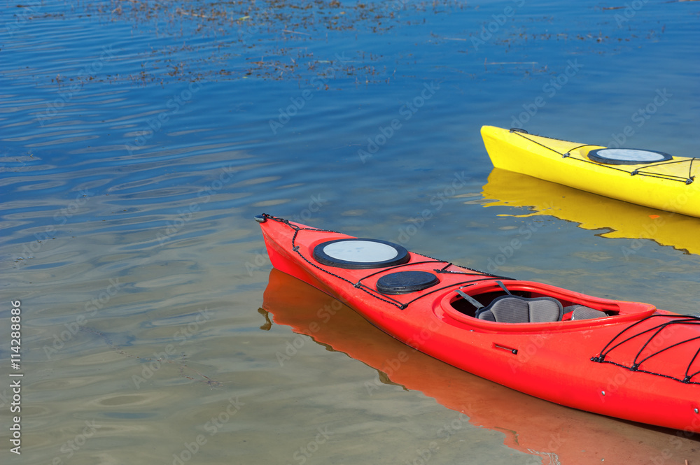 pair of single kayaks in a row