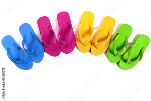 Summer beach flip flops or flipflops semi circle line row isolated on white background teamwork team family vacation photo