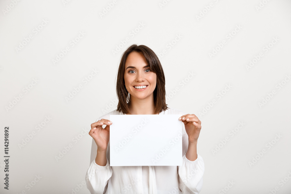 Portrait of young successful business woman over white backgroun Portrait of young successful business woman over white backgroun