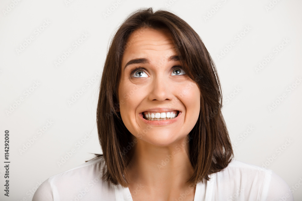 Portrait of girl playing ape over white background. Portrait of girl playing ape over white background.