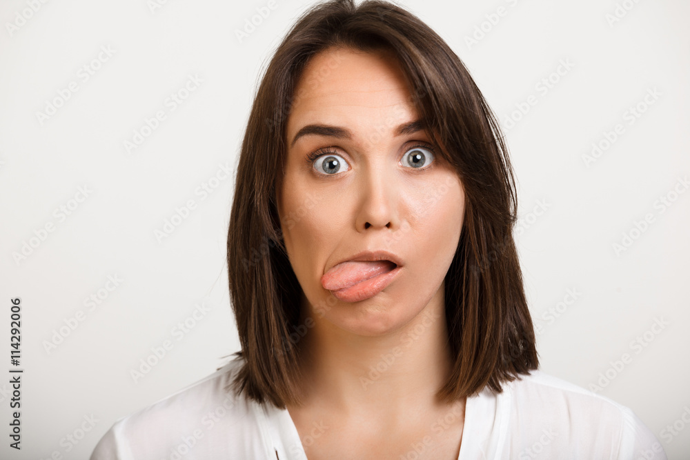 Portrait of girl playing ape over white background. Portrait of girl playing ape over white background.