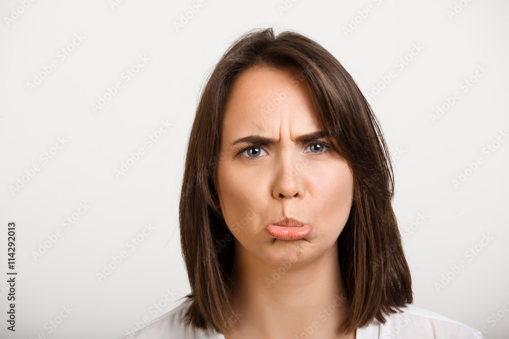Portrait of girl playing ape over white background. Portrait of girl playing ape over white background.