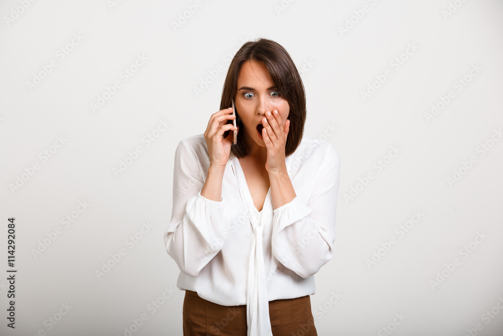 Portrait of young successful business woman over white backgroun Portrait of young successful business woman over white backgroun