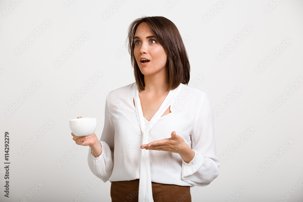 Portrait of young successful business woman over white backgroun Portrait of young successful business woman over white backgroun