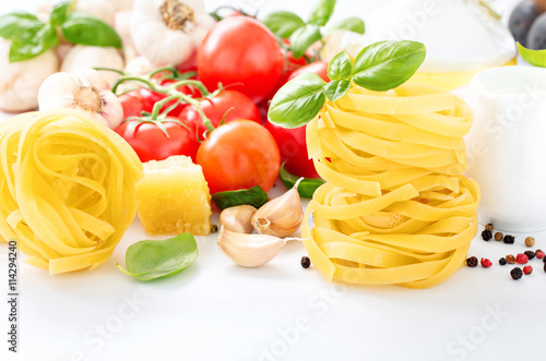 Fettuccine closeup with ingredients for cooking pasta