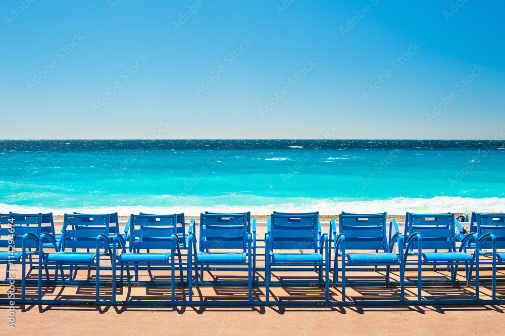 Blue chairs on the Promenade des Anglais in Nice, France