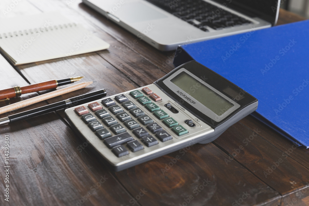 calculator, laptop computer, pen and notebook on office desk calculator, laptop computer, pen and notebook on office desk